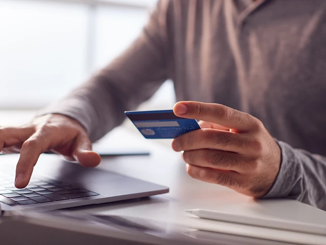 man paying with card online
