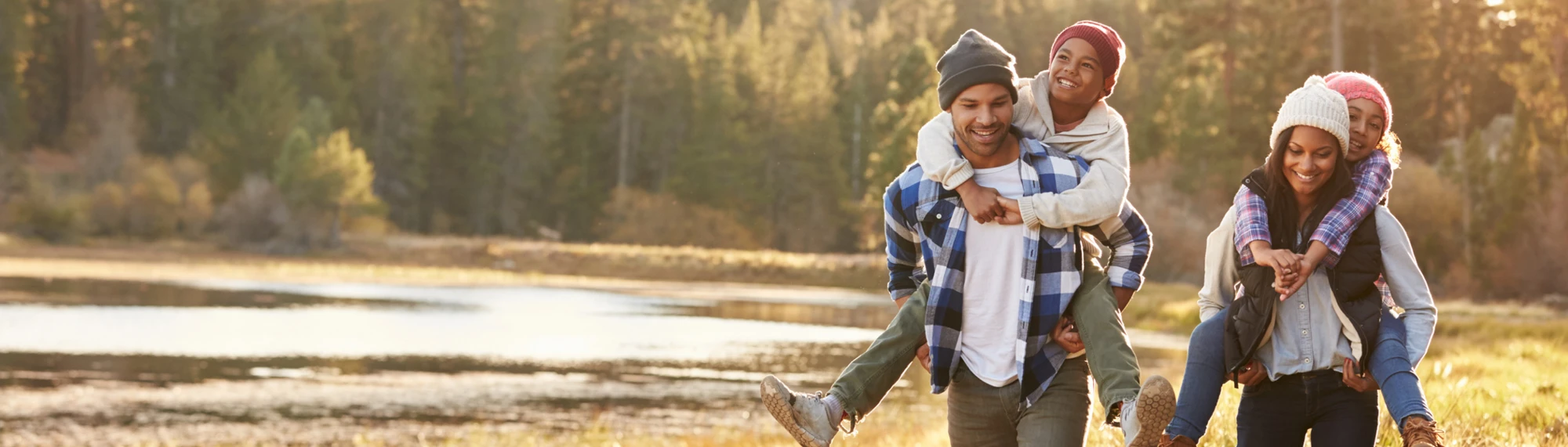family walking by lake
