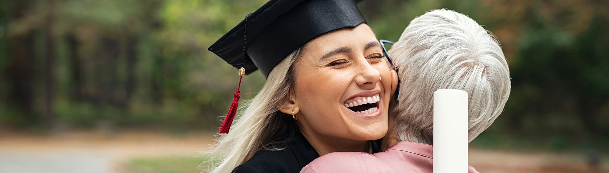 college graduate hugging mom
