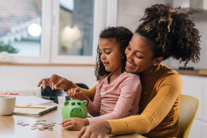 african american mom and daughter saving