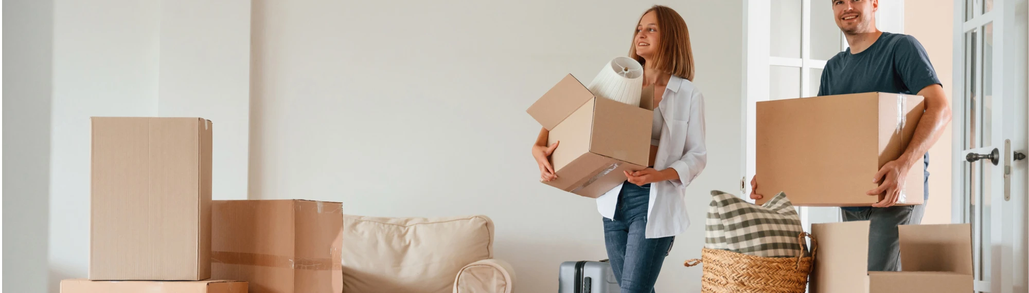 young caucasian couple moving in to new home with dog